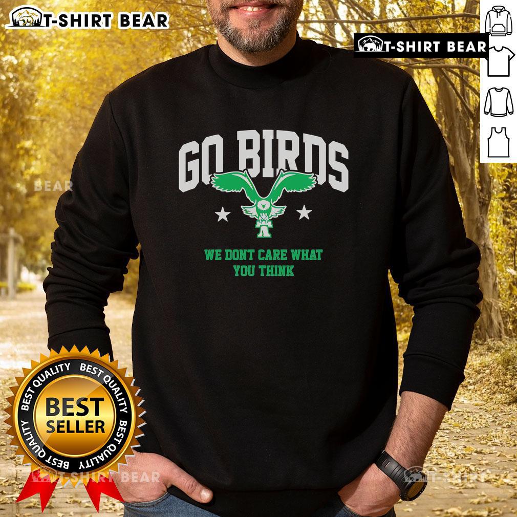 Casual sweatshirt featuring 'We Don't Care What You Think' slogan, perfect for bird lovers. Top Go Birds style.