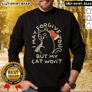Top I May Forgive You But My Cat Won't Sweatshirt featuring a humorous cat graphic on a cozy pullover.