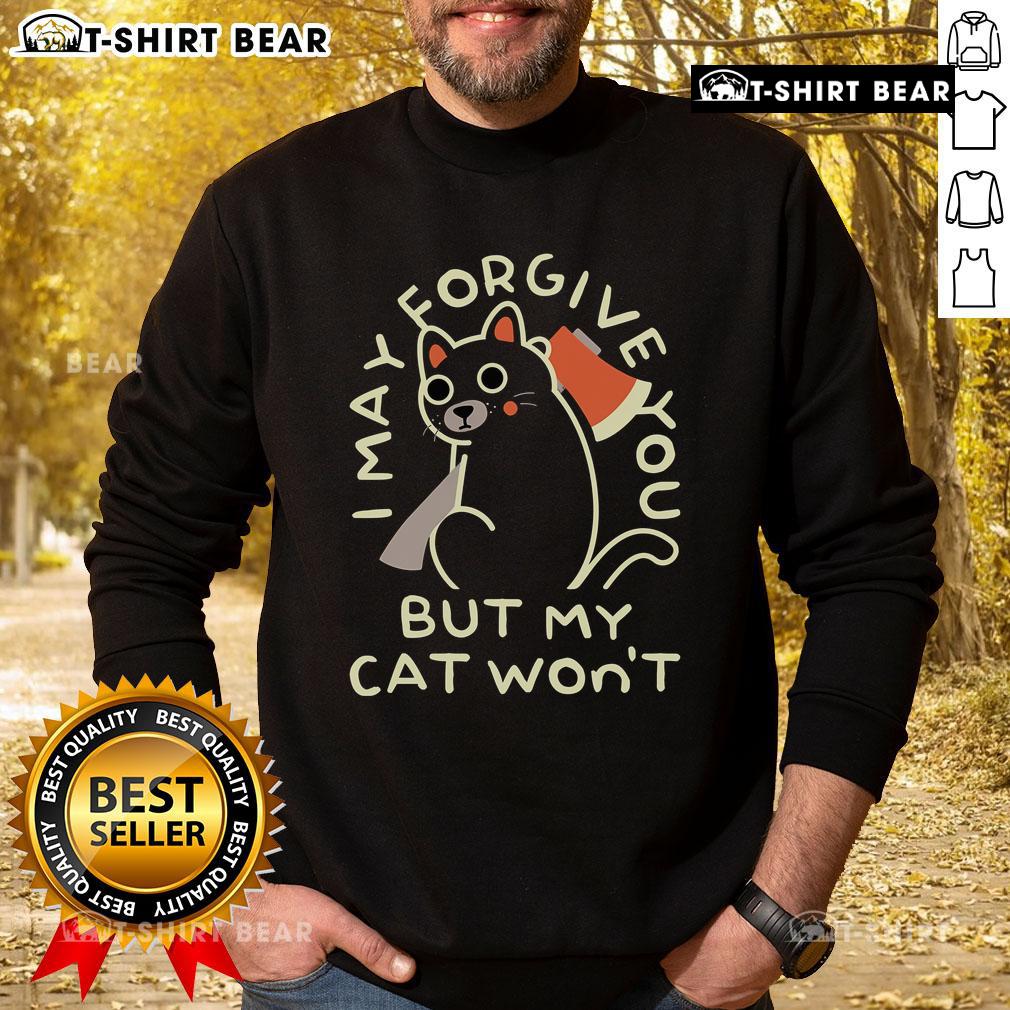Top I May Forgive You But My Cat Won't Sweatshirt featuring a humorous cat graphic on a cozy pullover.