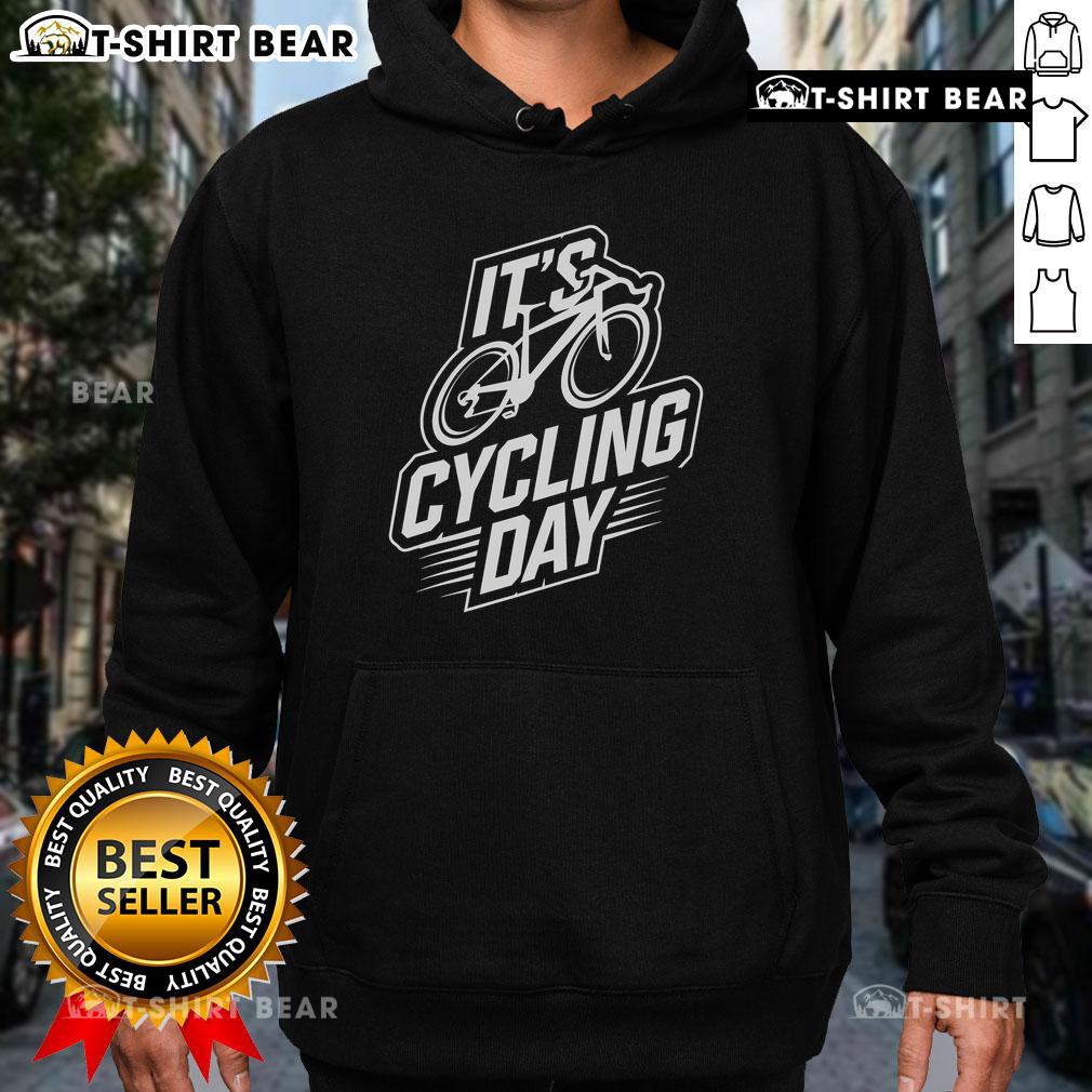 Cyclist wearing a stylish cycling hoodie, showcasing Top It's Cycling Day accessories for biking enthusiasts.