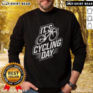 Top It's Cycling Day sweatshirt for cyclists, showcasing stylish cycling accessories in a vibrant outdoor setting.