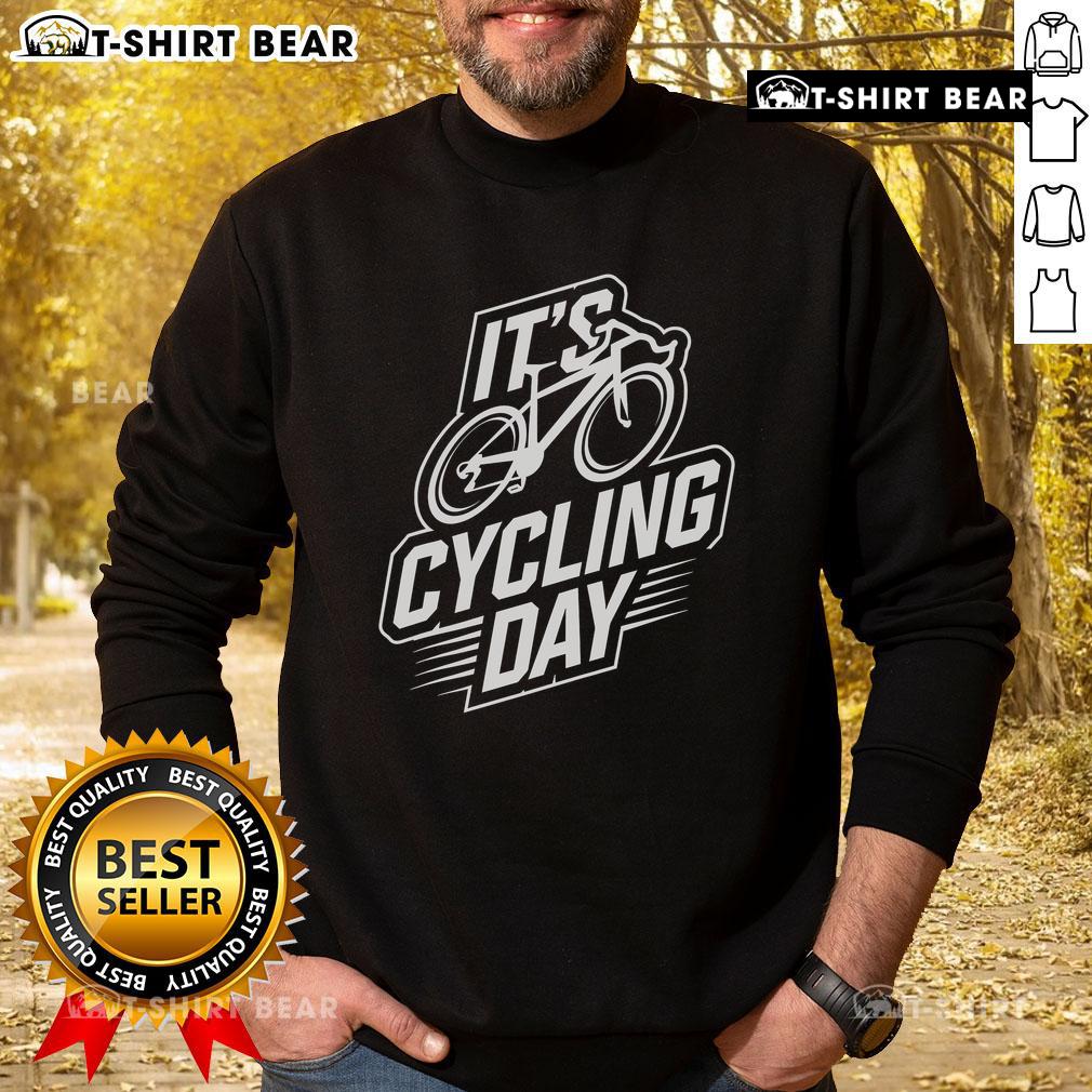 Top It's Cycling Day sweatshirt for cyclists, showcasing stylish cycling accessories in a vibrant outdoor setting.