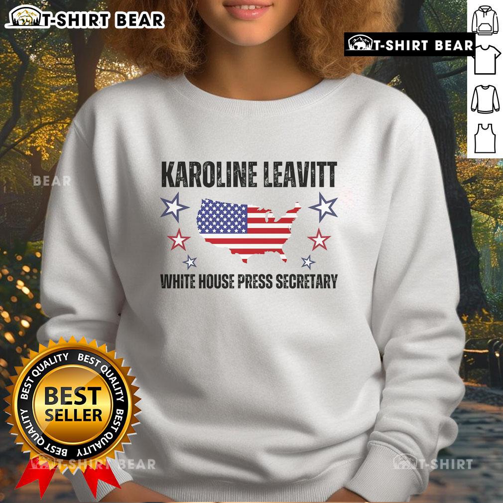Karoline Leavitt wearing a White House Press Secretary sweatshirt, showcasing her style and political passion.