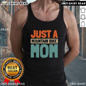 Mountain bike mom wearing a stylish tank top while biking on a scenic trail, showcasing her passion for MTB.