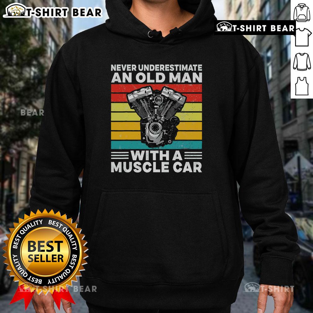 Old man in a muscle car hoodie showcasing confidence and style, embodying the spirit of 'Never Underestimate an Old Man'.