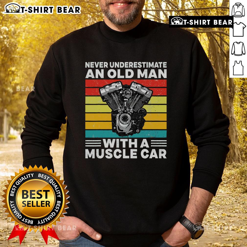 Top Never Underestimate An Old Man With A Muscle Car Sweatshirt worn by a man smiling in a vintage muscle car.