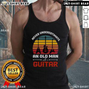 Cool musician in a tank top playing a vintage guitar, showcasing the top vintage music style with retro vibes.