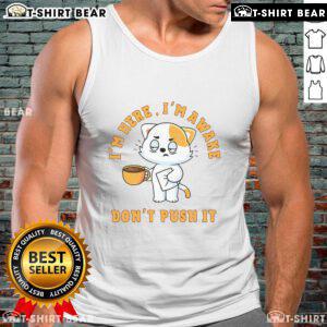 Adorable cat in a coffee tank top, playfully awake and ready for the day - 'Cute I'm Here I'm Awake Don't Push' design.