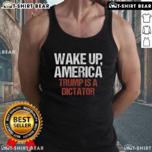 Protest tank top reading 'Hot Wake Up America: Trump is a Dictator' worn at a political demonstration.