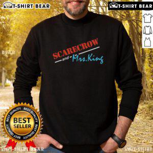 Cozy 'Nice Scarecrow and Mrs. King' sweatshirt featuring vibrant fall colors, perfect for autumn fashion and comfort.