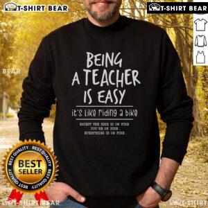 Alt Text: Official 'Being A Teacher Is Easy Like Riding A Bike' sweatshirt, perfect for educators showcasing their passion.