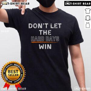Alt Text: Premium Dont Let The Hard Days Win T-Shirt featuring motivational text design on a stylish black background.