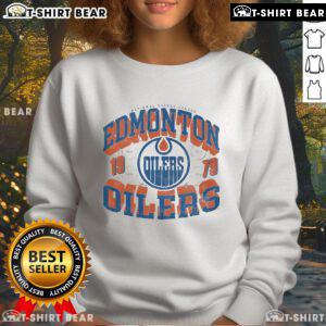 Edmonton Oilers rink sweatshirt featuring an arched wordmark design, perfect for fans and cozy wear.