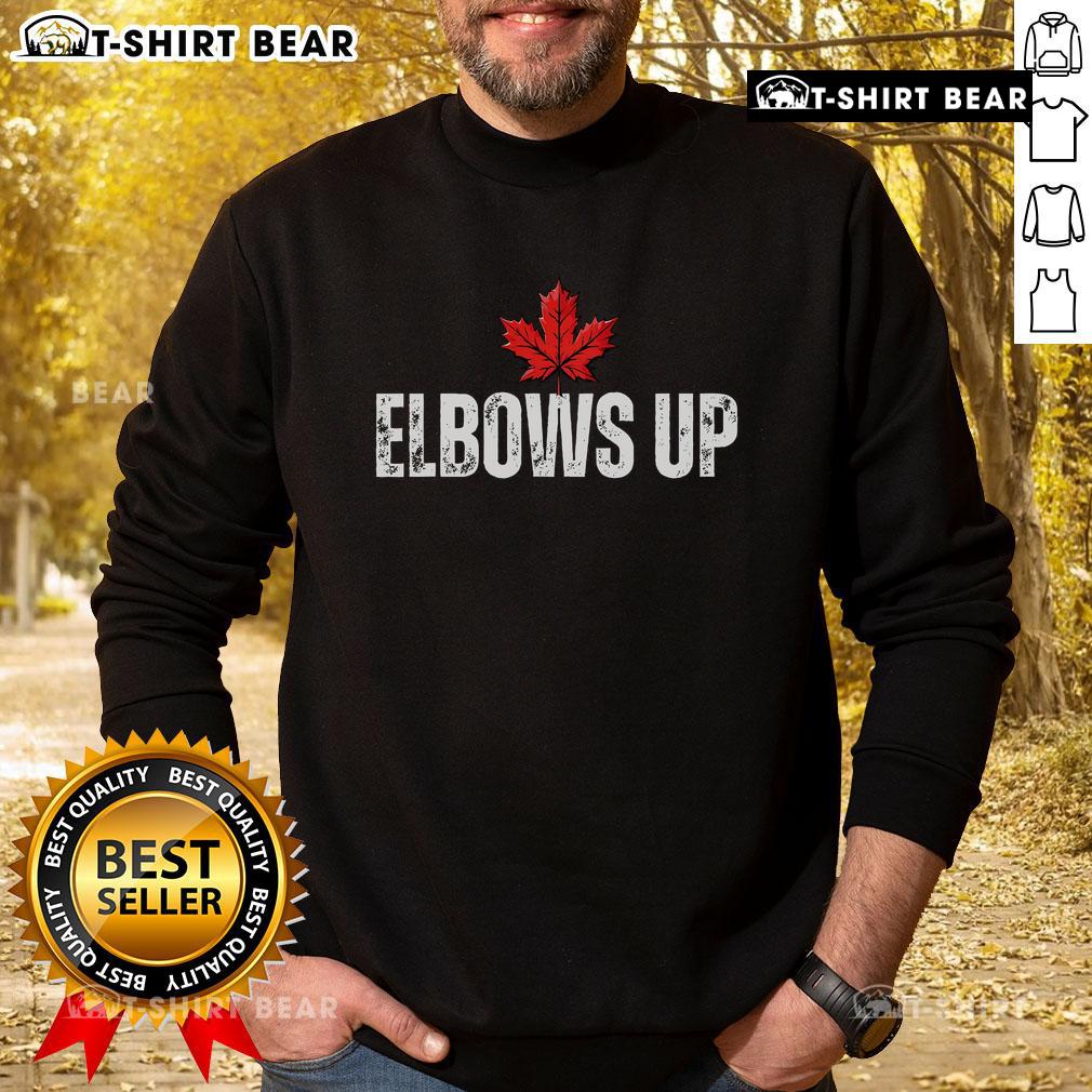 Alt Text: Proud Canadian sweatshirt with 'True North Strong and Free' slogan, featuring top-elbows-up design for Canada fans.