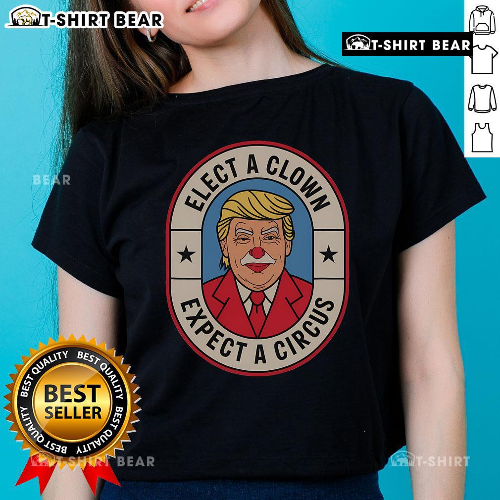 Anti-Trump ladies tee featuring 'Elect A Clown, Expect A Circus' slogan, perfect for political rallies and protests.