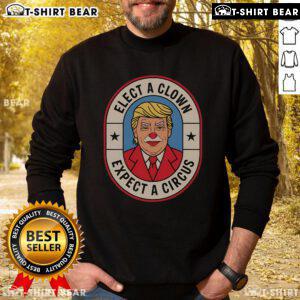 Anti-Trump sweatshirt featuring 'Top Elect A Clown, Expect A Circus' slogan, perfect for political protests and activism.