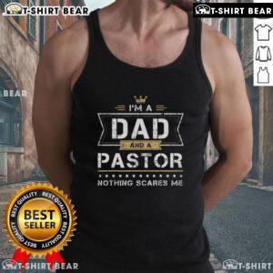 Man wearing 'Top Im a Dad and a Pastor, Nothing Scares Me' tank top, showcasing confidence and humor in fatherhood.