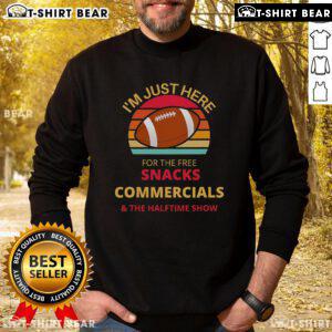 Cozy sweatshirt featuring 'I'm Just Here For The Free Snacks' for halftime show fans, perfect for game day comfort.