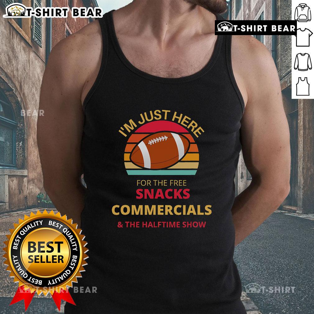 Top Im Just Here For The Free Snacks tank top worn during a halftime show, featuring bold graphics and a fun design.