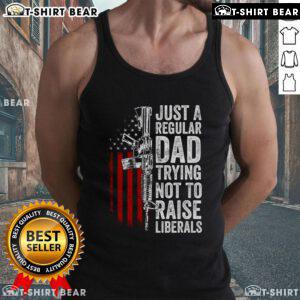 Top Just A Regular Dad Trying Not To Raise Liberals Tank Top showcasing a humorous dad-themed graphic design.