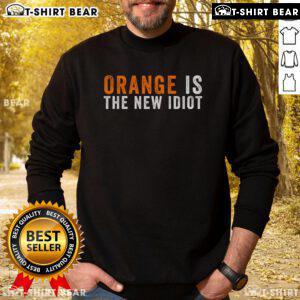 Top Orange Is The New Idiot Sweatshirt featuring bold graphic design and cozy fabric, perfect for casual wear.