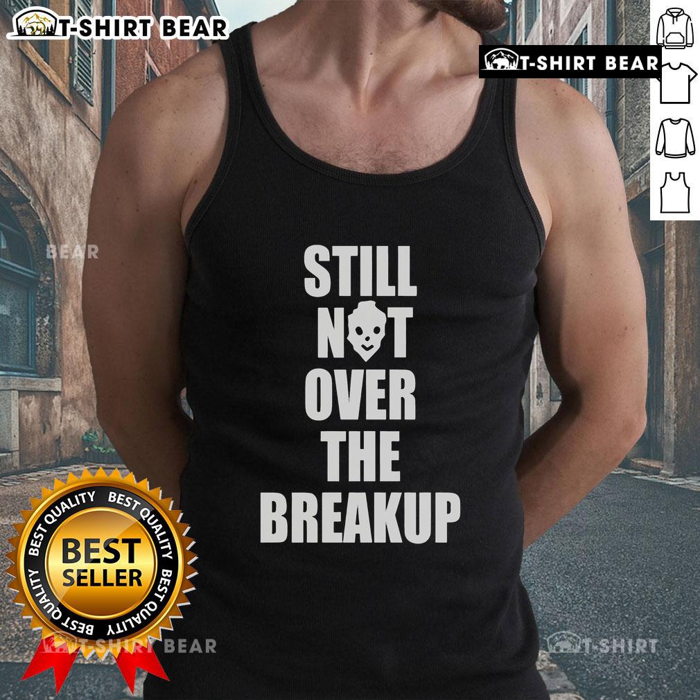 Trendy 'Top Still Not Over The Breakup' tank top in black with bold lettering, perfect for expressing your feelings stylishly.