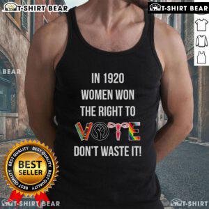 Empowered woman wearing 'Top Women Won The Right To Vote In 1920 Don't Waste It' tank top, celebrating women's suffrage.
