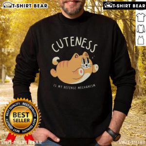Cute Cat Cuteness Is My Defense Mechanism Sweatshirt featuring an adorable cat graphic on a cozy, stylish design.
