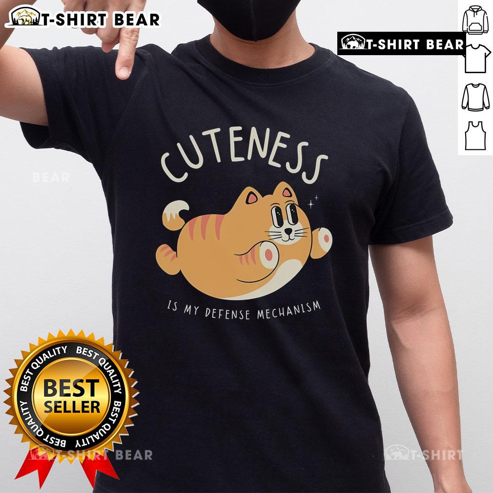 Alt Text: Cute Cat Cuteness Is My Defense Mechanism T-Shirt featuring an adorable cat graphic in vibrant colors.