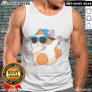 Cute dabbing hamster in a funny pose wearing a pet tank top, showcasing the famous dab dance move. Perfect pet photo!