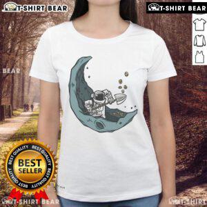 Funny astronaut mining coins on the moon graphic for ladies' tee, perfect for space lovers and humor enthusiasts.
