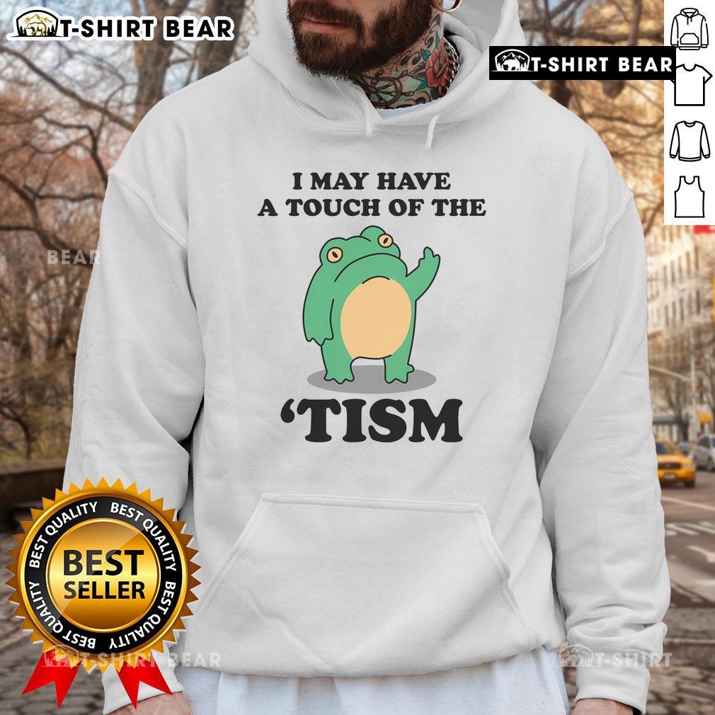 Person wearing a 'Good I May Have A Touch Of The Tism' hoodie, showcasing neurodivergent humor in a casual style.