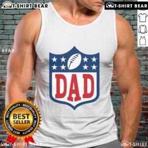 Happy dad wearing an American football tank top, enjoying a sunny day outdoors with friends and family.