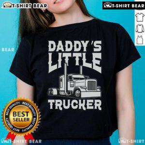 Happy semi truck with a girl wearing 'Daddy's Little Trucker' ladies tee, celebrating trucking lifestyle and family.