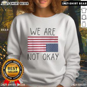 We Are Not Ok America sweatshirt featuring an upside-down flag and patriotic saying for a bold statement.