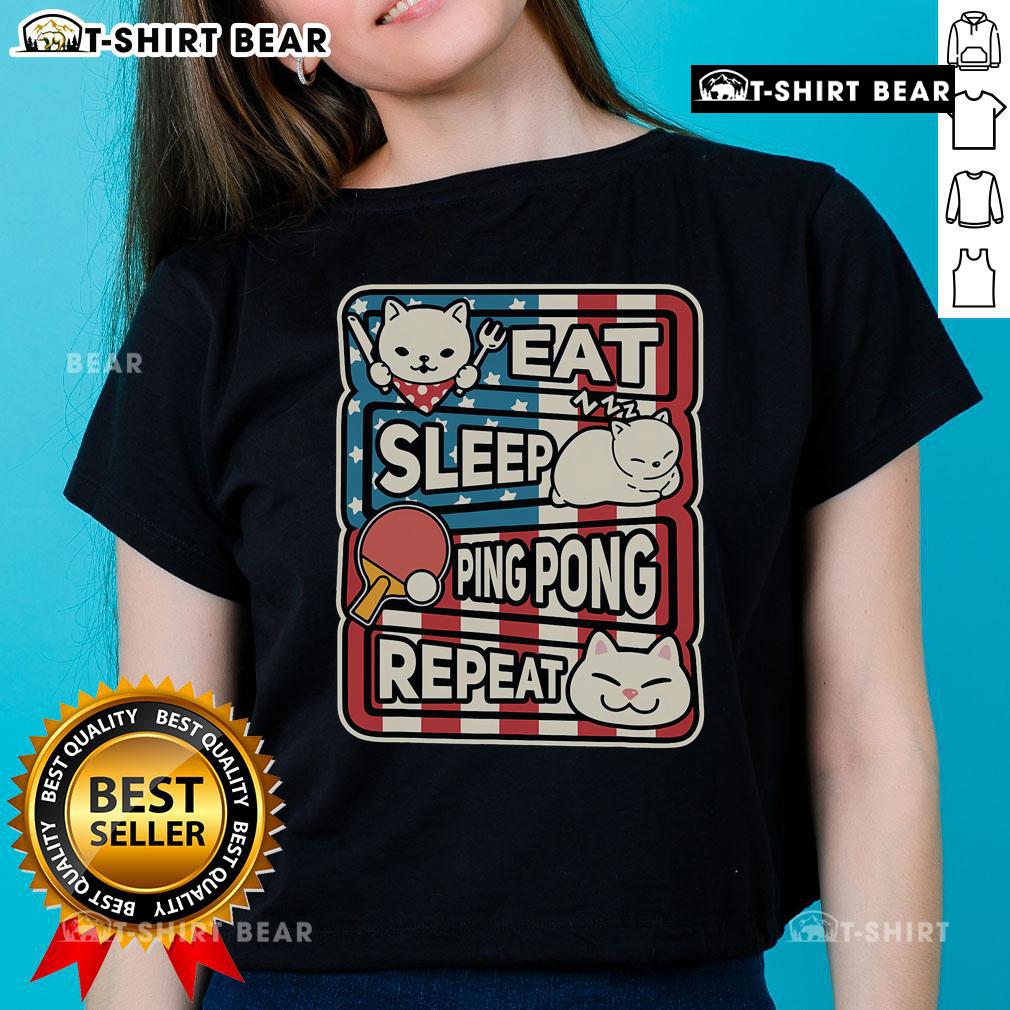 Patriotic ladies tee featuring a cute cat with a 'Eat Sleep Ping Pong Repeat' design, perfect for table tennis fans.
