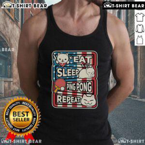 Adorable cat lounging in a patriotic tank top, perfect for ping pong enthusiasts: Eat, Sleep, Ping Pong, Repeat.