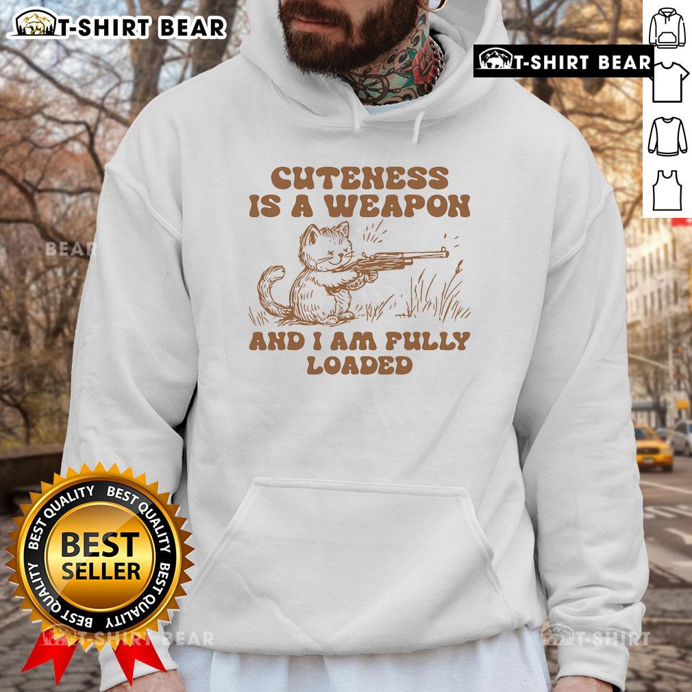 Stylish 'Pretty Cuteness Is A Weapon' cat hoodie featuring an adorable cat graphic, perfect for cozy fashion lovers.
