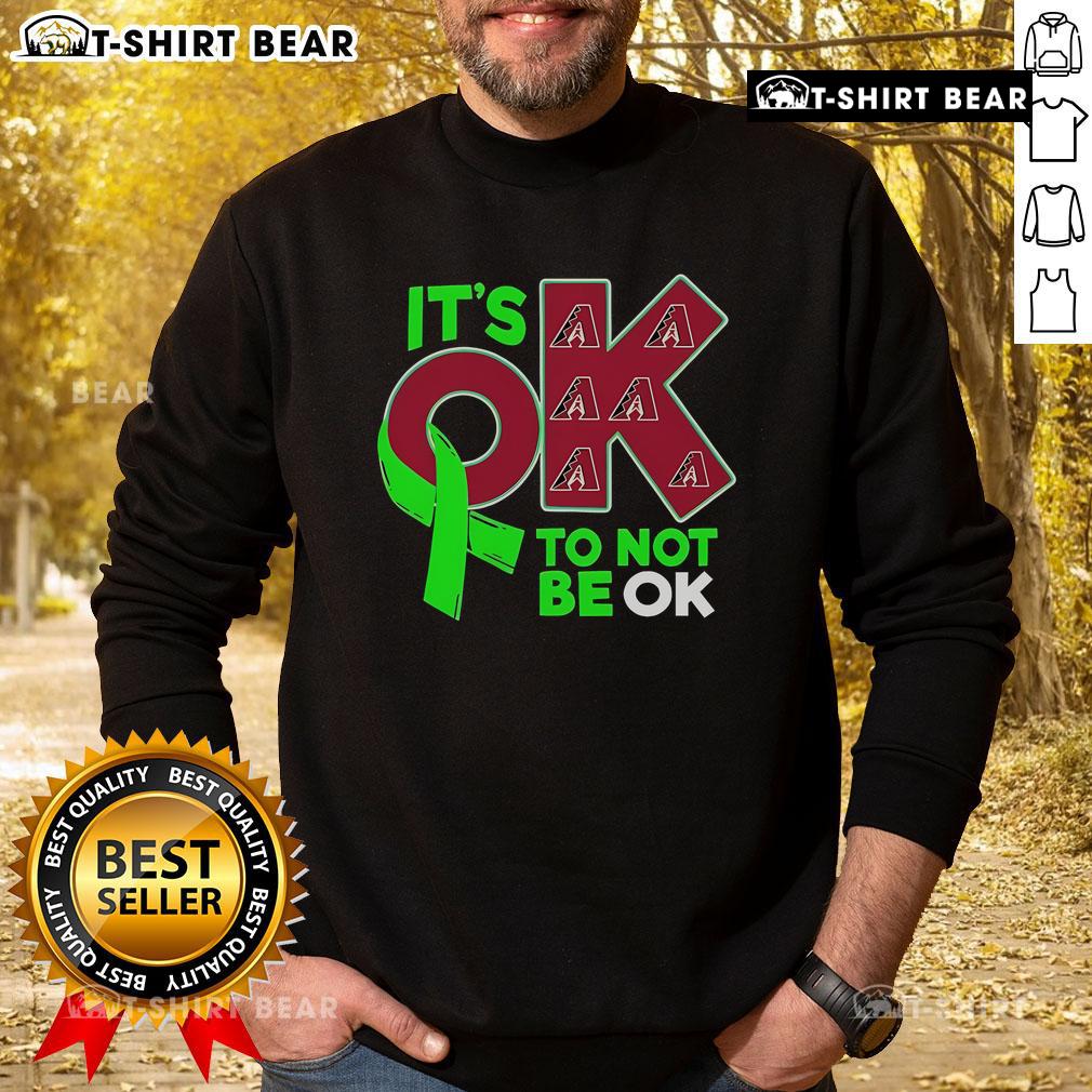 Cozy Arizona Diamondbacks 'It's Ok To Not Be Ok' sweatshirt featuring team colors and logo, perfect for fans.