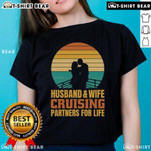 Couple enjoying a sunset cruise, wearing matching vintage tees: 'Top Husband and Wife Cruising Partners for Life'.