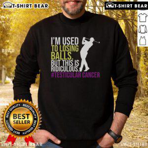 Top Testicular Cancer Awareness Month sweatshirt worn by a survivor golfer, promoting awareness and support for April events.