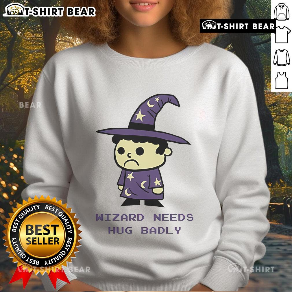 Cozy Top Wizard Needs Hugs Badly Sweatshirt featuring a whimsical design, perfect for magic lovers and comfort seekers.