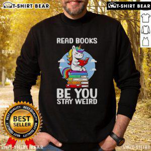 Alt Text: Cozy 'Be You, Stay Weird' unicorn sweatshirt for book lovers, perfect for casual wear and expressing individuality.