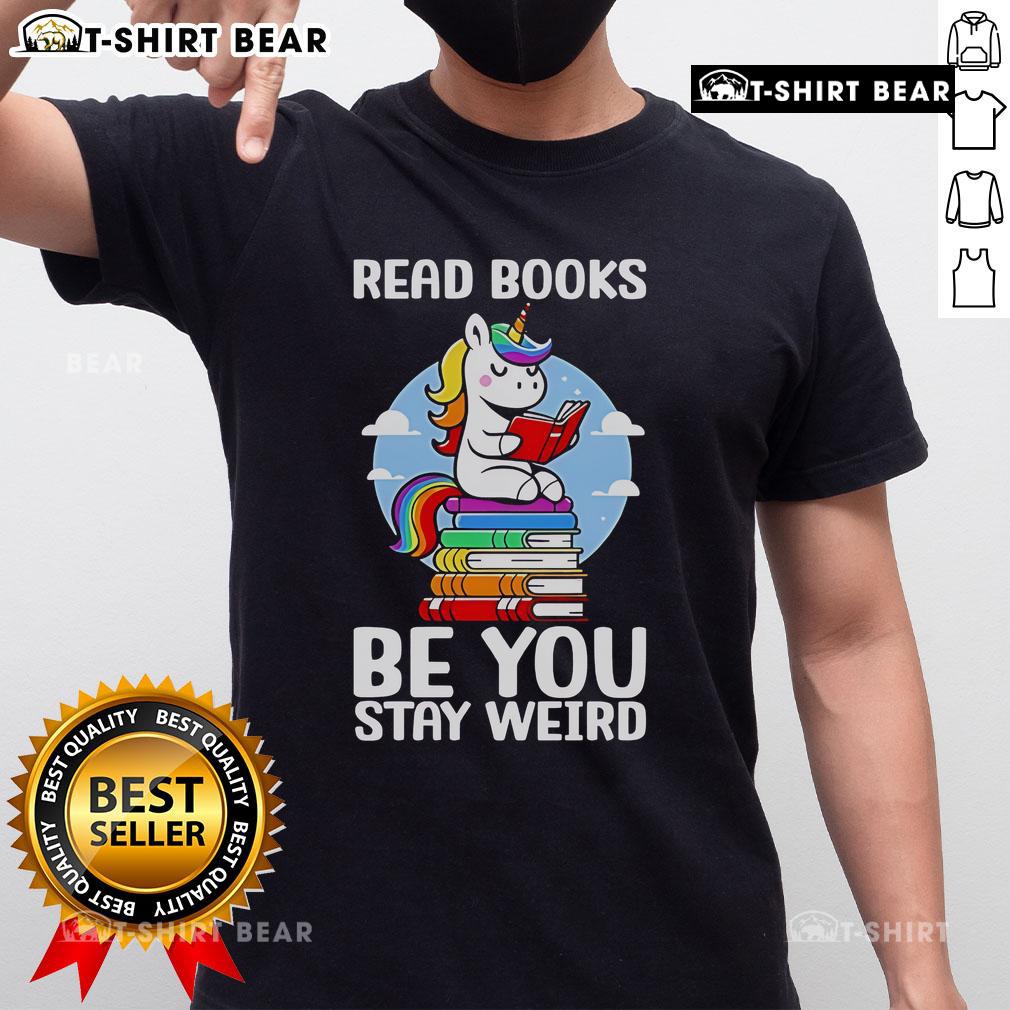 Unicorn T-shirt featuring 'Be You Stay Weird' slogan, perfect for book lovers and unique fashion enthusiasts.
