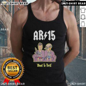 Beavis and Butt-Head AR-15 Shoot to Thrill tank top displayed on a sofa, showcasing vibrant artwork and stylish design.
