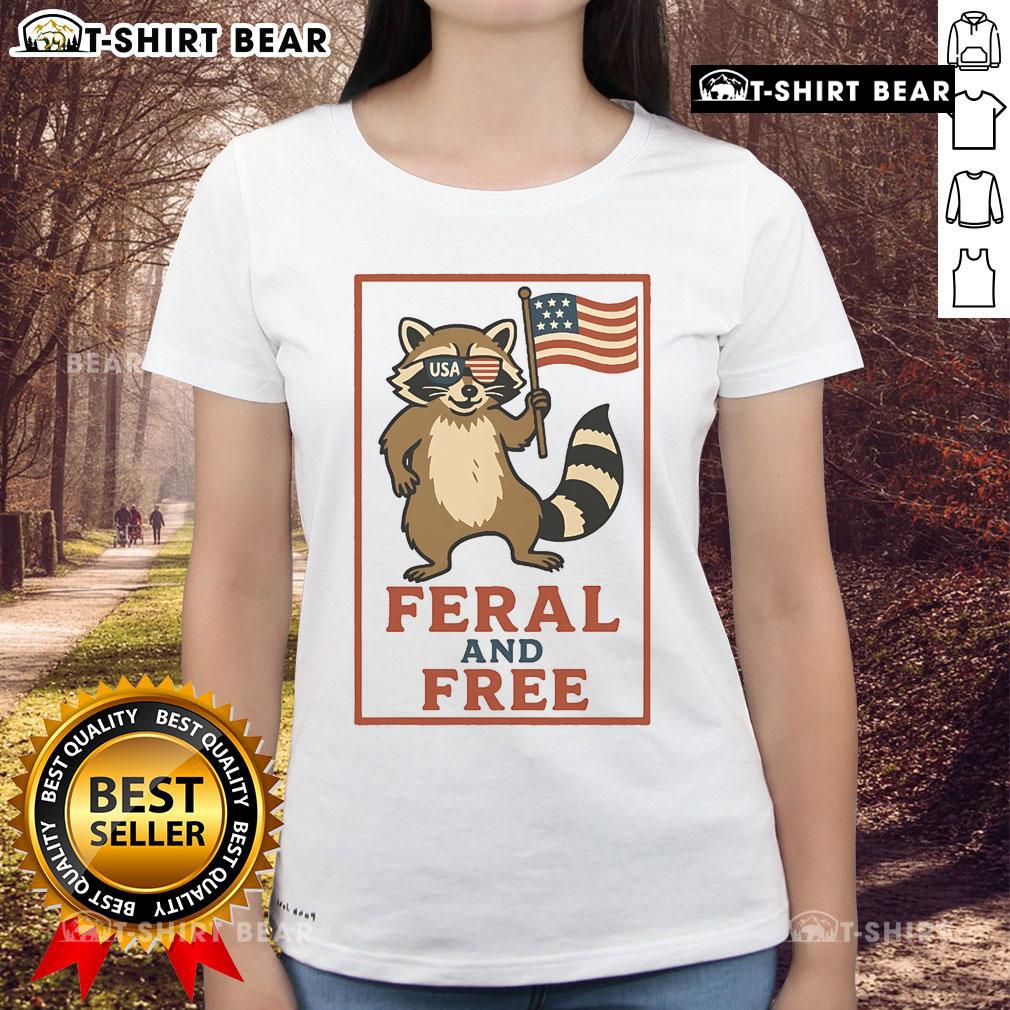 Alt Text: Feral and Free raccoon graphic on America flag ladies tee, perfect for patriotic animal lovers.