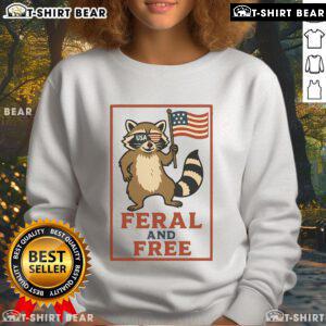 Alt Text: Official Feral and Free Raccoon America Flag Sweatshirt featuring a patriotic raccoon design on a cozy sweatshirt.