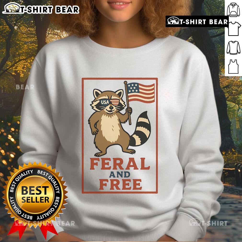 Alt Text: Official Feral and Free Raccoon America Flag Sweatshirt featuring a patriotic raccoon design on a cozy sweatshirt.