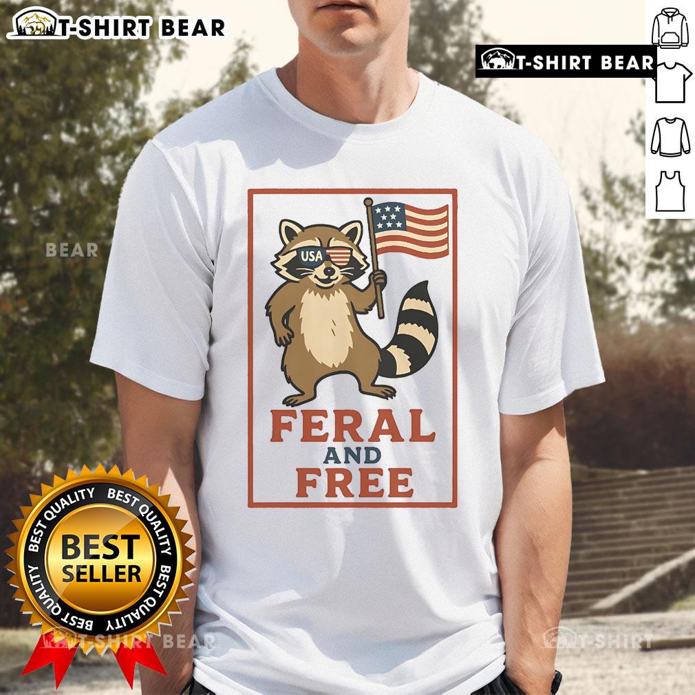 Official Feral And Free Raccoon America Flag T-Shirt featuring a raccoon graphic on a patriotic flag design.