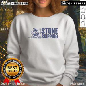 Official Stone Skipping Splash Sweatshirt featuring a vibrant splash design, perfect for fans of water sports and outdoor activities.